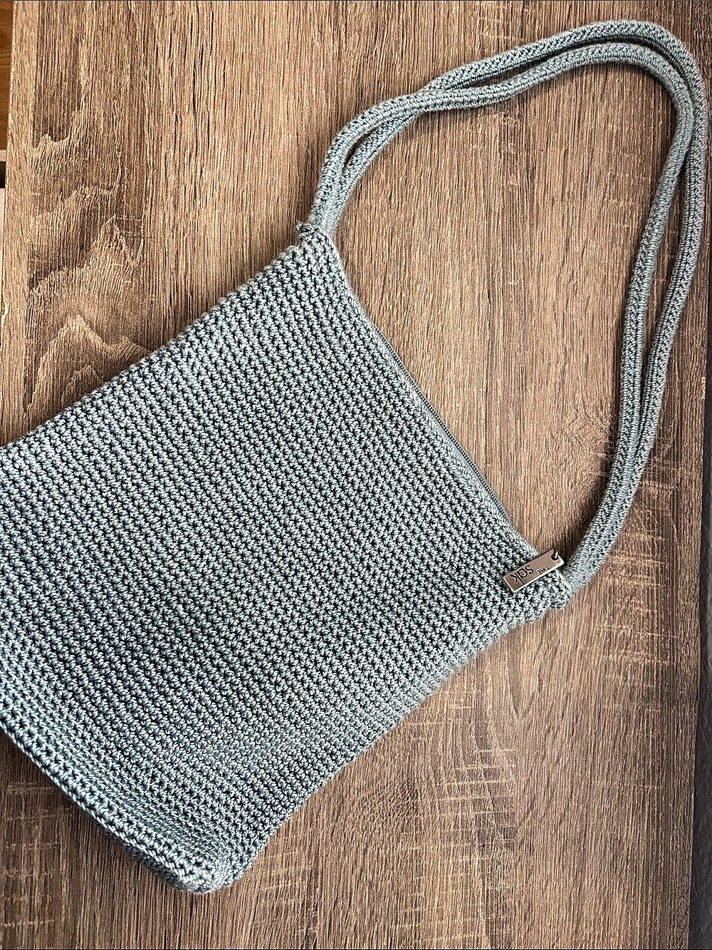 The Sak Knit Crossbody Bag
Blue grey color
